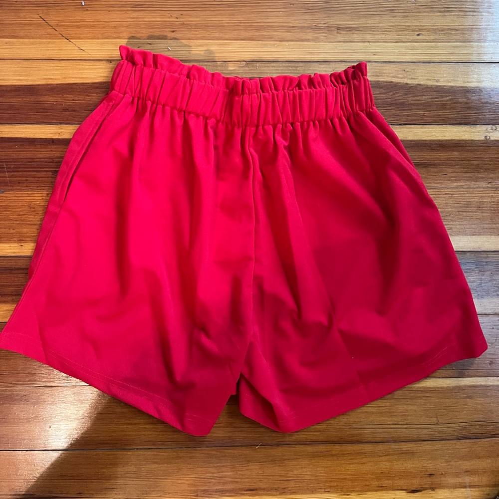 New with tags, high waisted red shorts, size medium